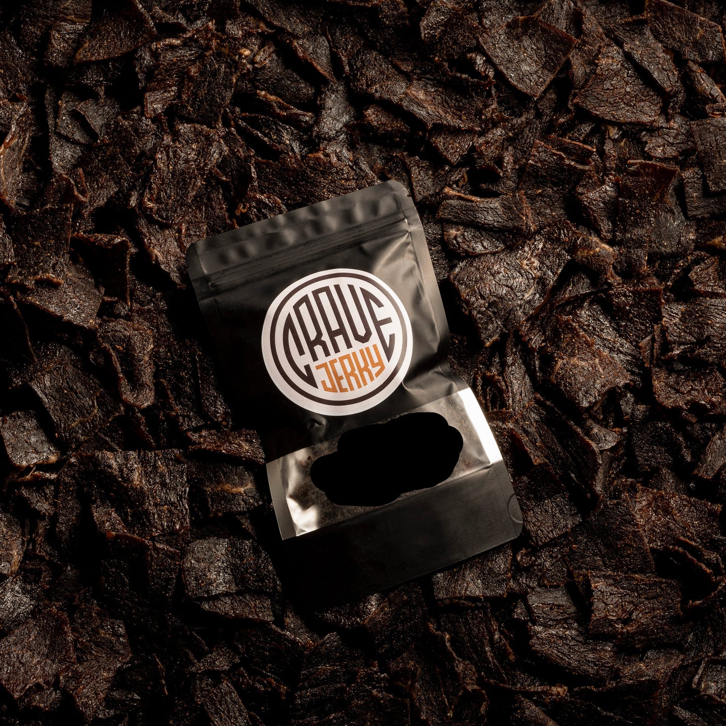 A lot of beef jerky bag with jerky on top roasted garlic flavor