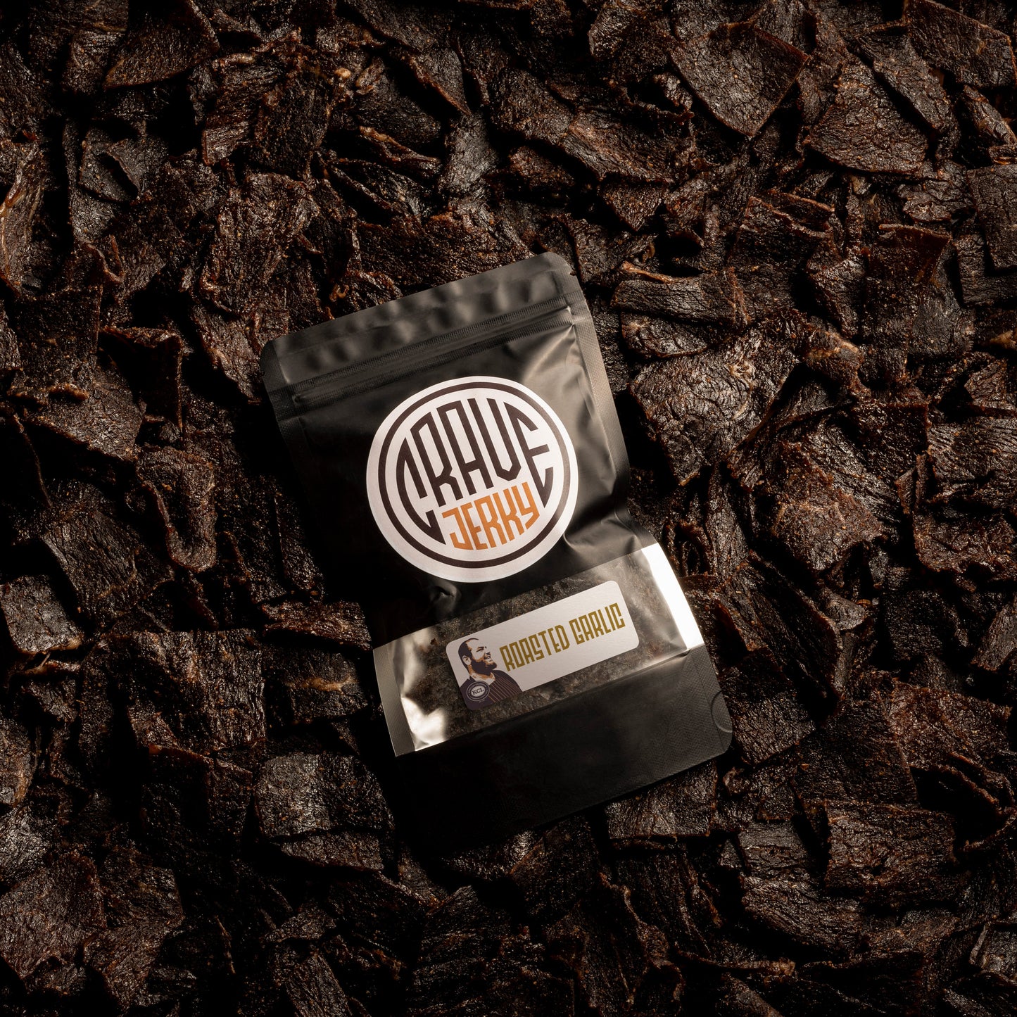 A lot of beef jerky bag with jerky on top roasted garlic flavor