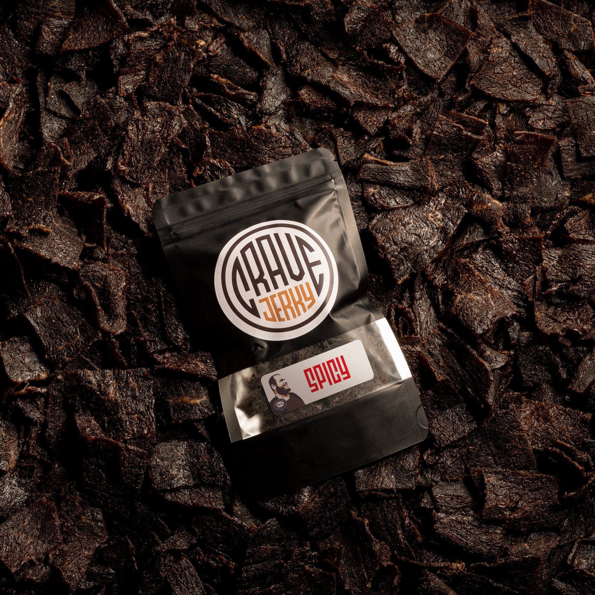 "Crave Kosherspicy beef jerky - small batch KCL certified. on a bed of jerky